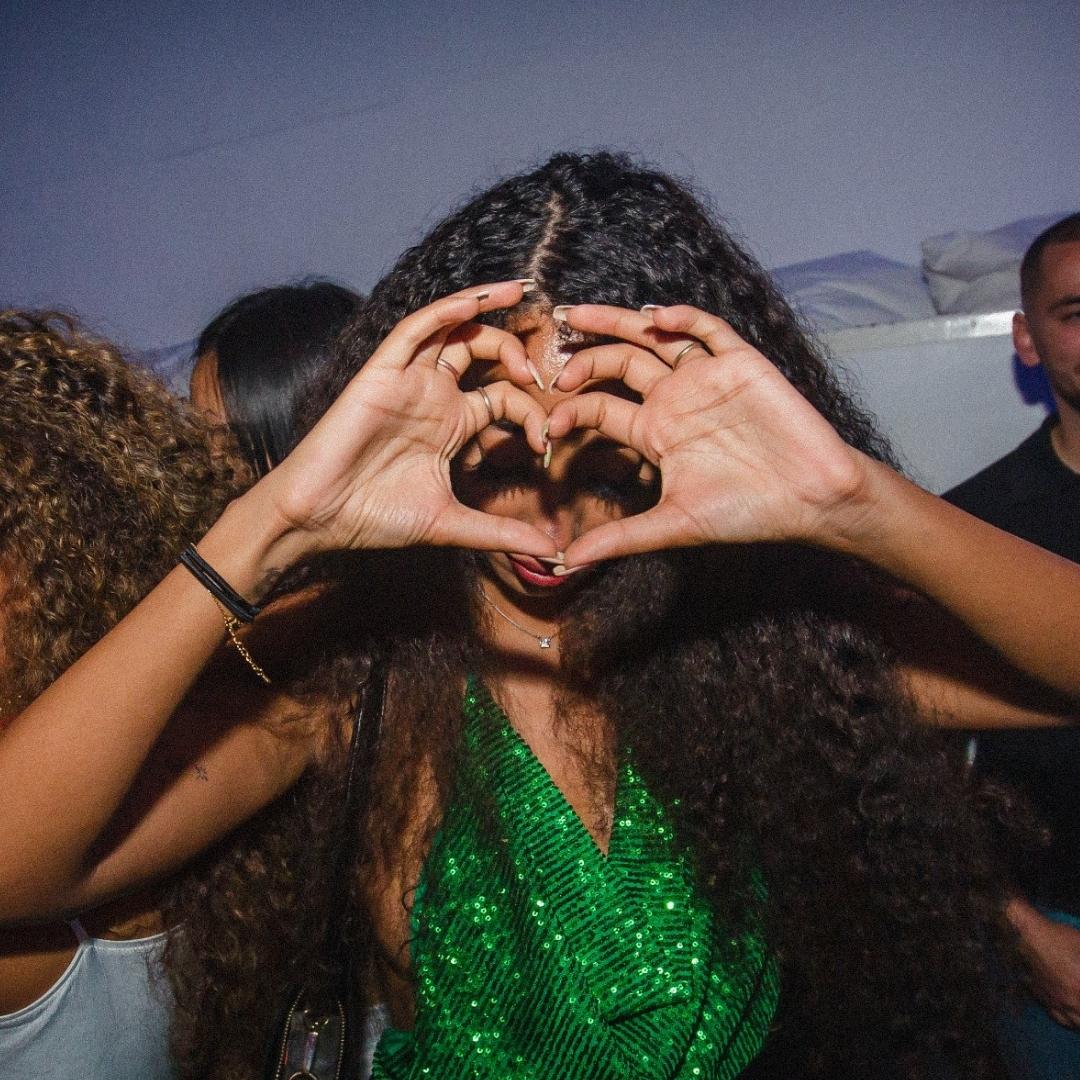 Women making heart sign in the VIP of Supper Club