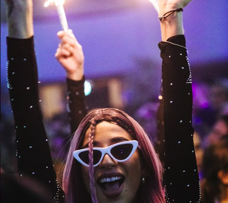 Girl celebrating with sparklers at Supper Club nightclub